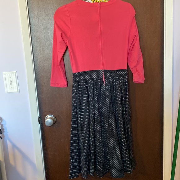 Pinup girl clothing is dress with pink too and black and polka dot skirt - Picture 5 of 5